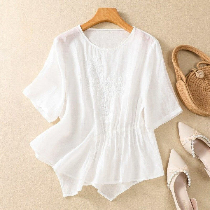 Relaxed Embroidered Blouse with Asymmetrical Hem and Soft Pleated Detail