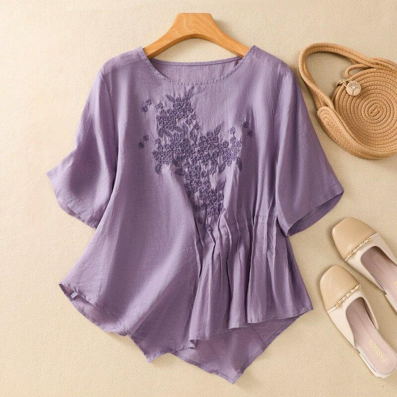 Relaxed Embroidered Blouse with Asymmetrical Hem and Soft Pleated Detail