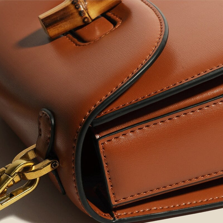 Bamboo Handle Structured Crossbody Satchel with Signature Turn Lock