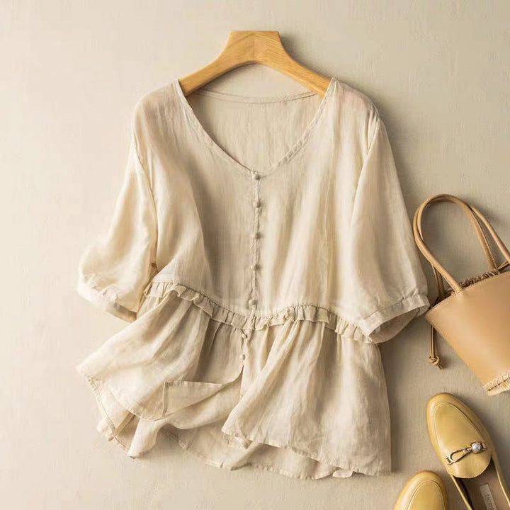 Flowy Peplum Blouse with Soft V Neckline and Ruffle Waist Detail